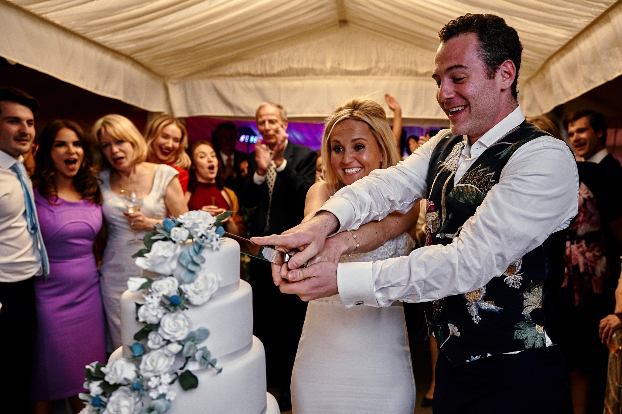 Bride and Groom cut wedding cake